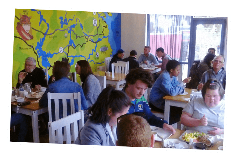 Group of people having meal at tain cafe